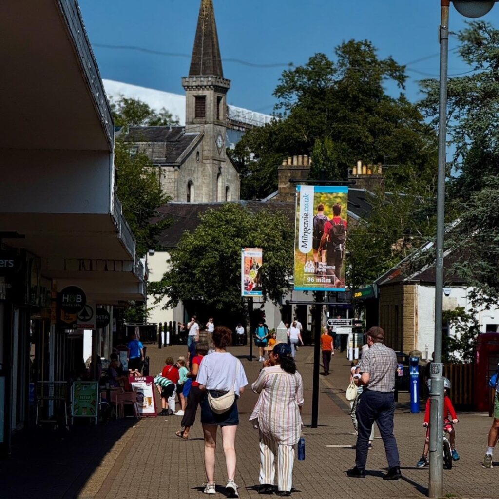 Milngavie town centre people shopping on sunny day